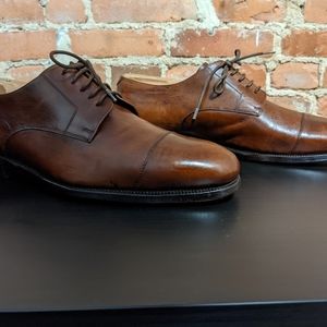 Men's Ralph Lauren brown leather cap toe derby shoes.